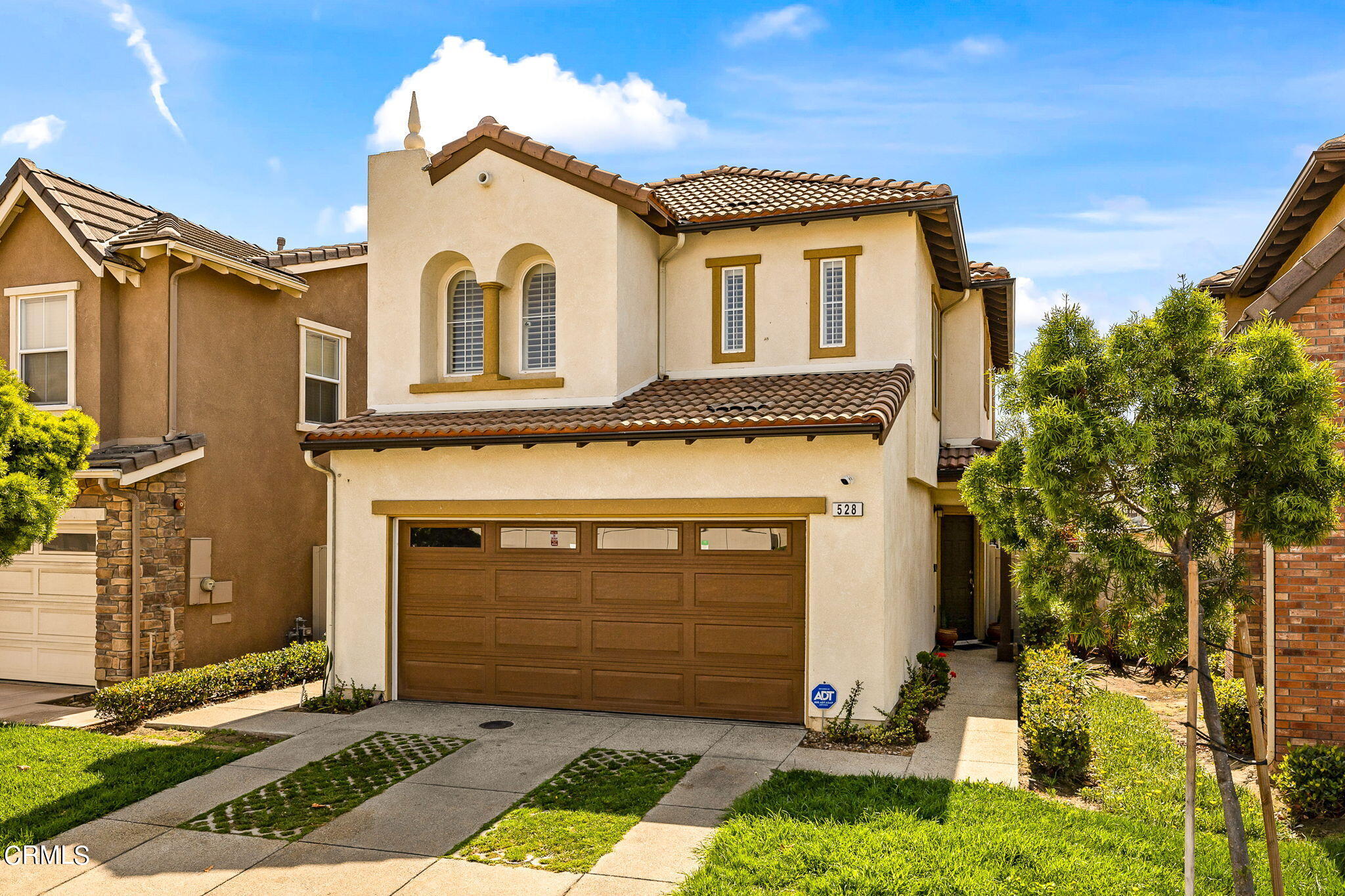 528 Field Street Oxnard, CA 93033 - Photo 1 of 24 a front view of a house with a yard and garage