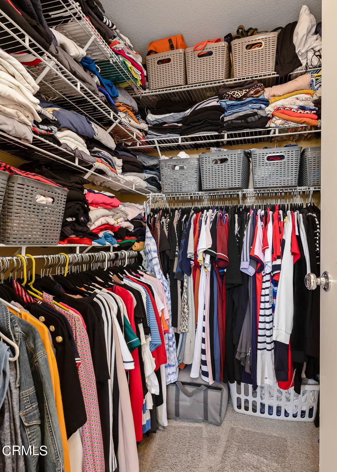 528 Field Street Oxnard, CA 93033 - Photo 11 of 24 a view of walk in closet with clothes and shoes