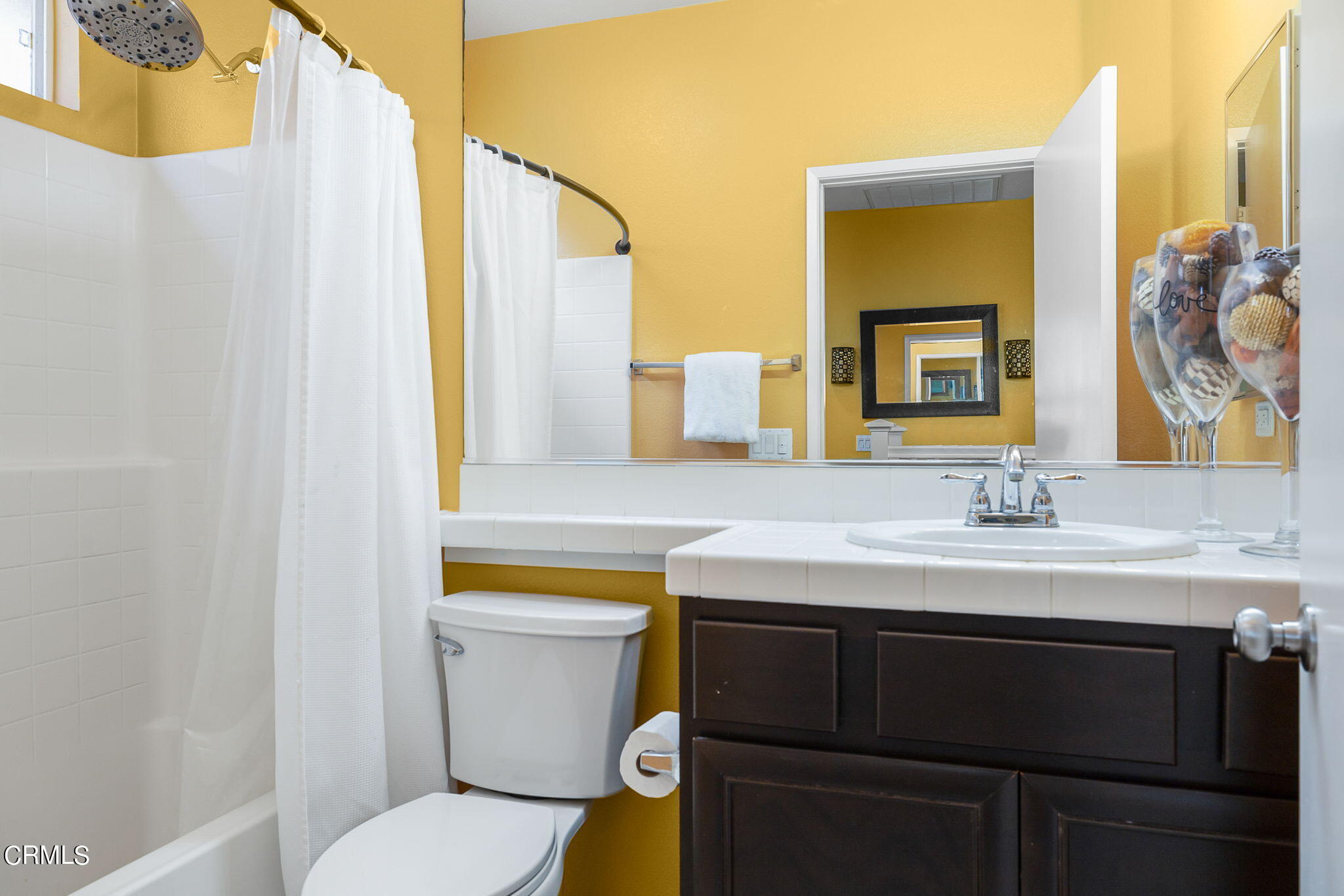 528 Field Street Oxnard, CA 93033 - Photo 12 of 24 a bathroom with a granite countertop sink and a toilet