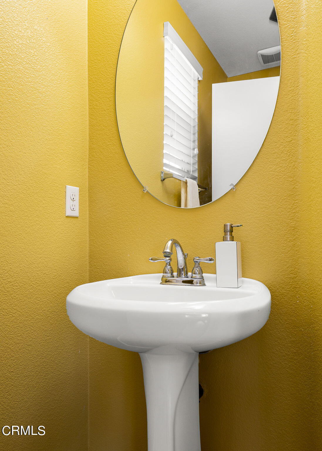 528 Field Street Oxnard, CA 93033 - Photo 14 of 24 a bathroom with a sink and a mirror