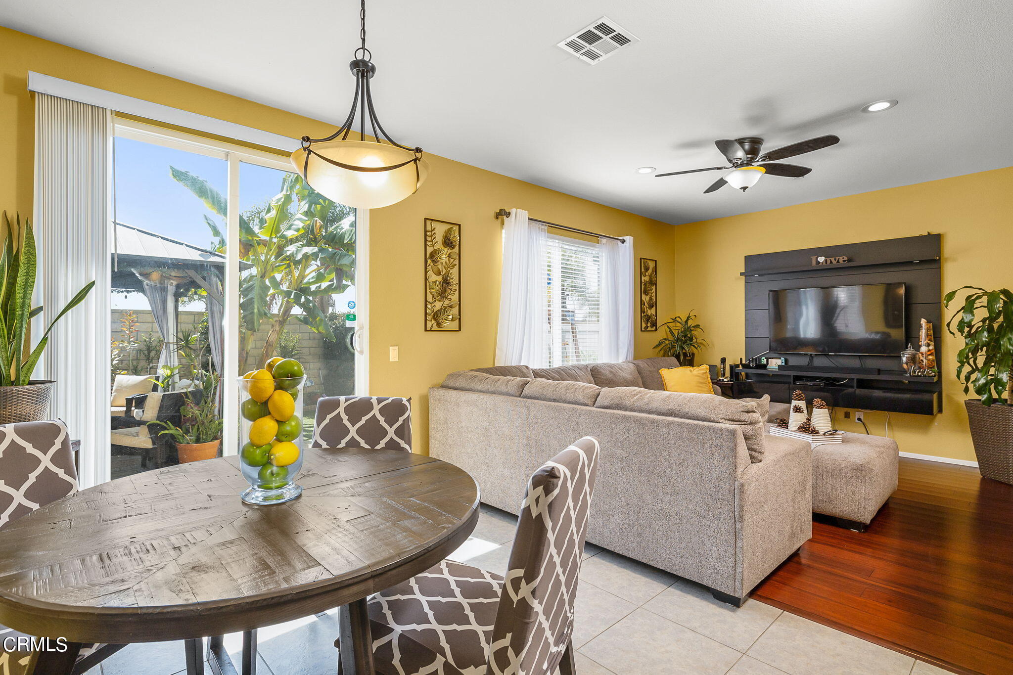 528 Field Street Oxnard, CA 93033 - Photo 22 of 24 a living room with furniture a chandelier and a flat screen tv