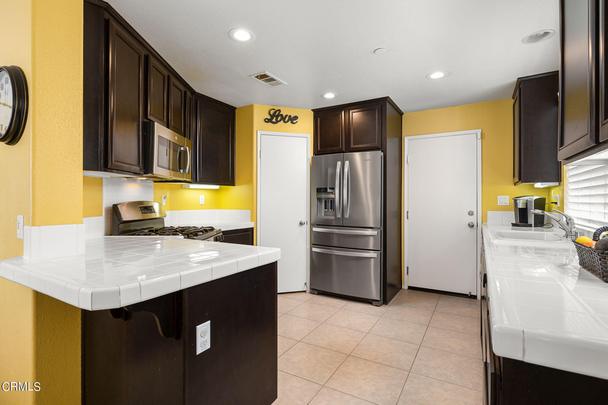 528 Field Street Oxnard, CA 93033 - Photo 4 of 24 a kitchen with refrigerator cabinets and a sink