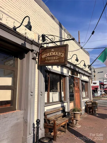 a view of a building with sitting area