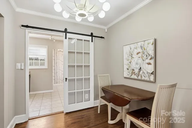 a view of a livingroom with furniture and wooden floor