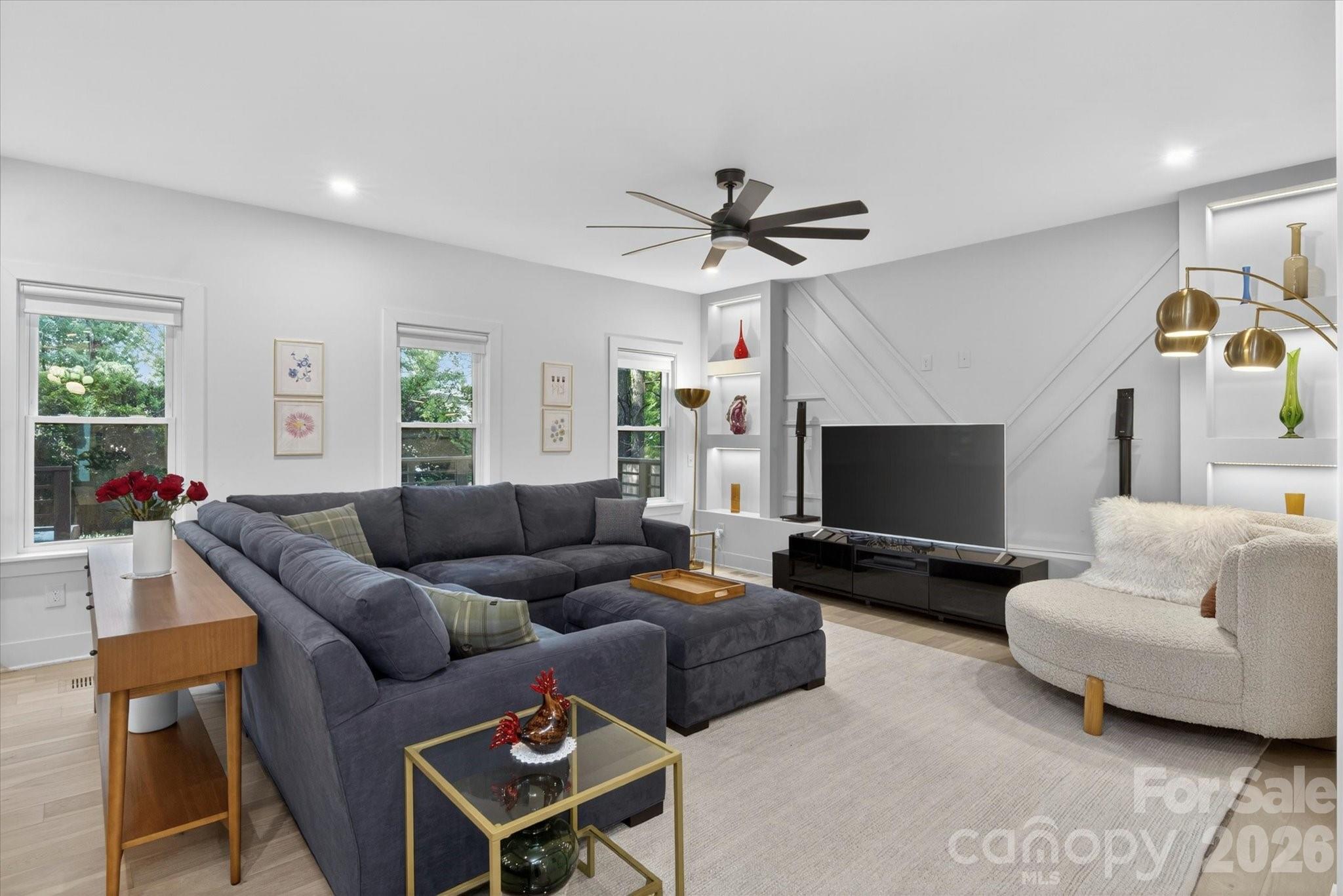 1608 Chippendale Road Charlotte, NC 28205 - Photo 16 of 46 a living room with furniture and a flat screen tv