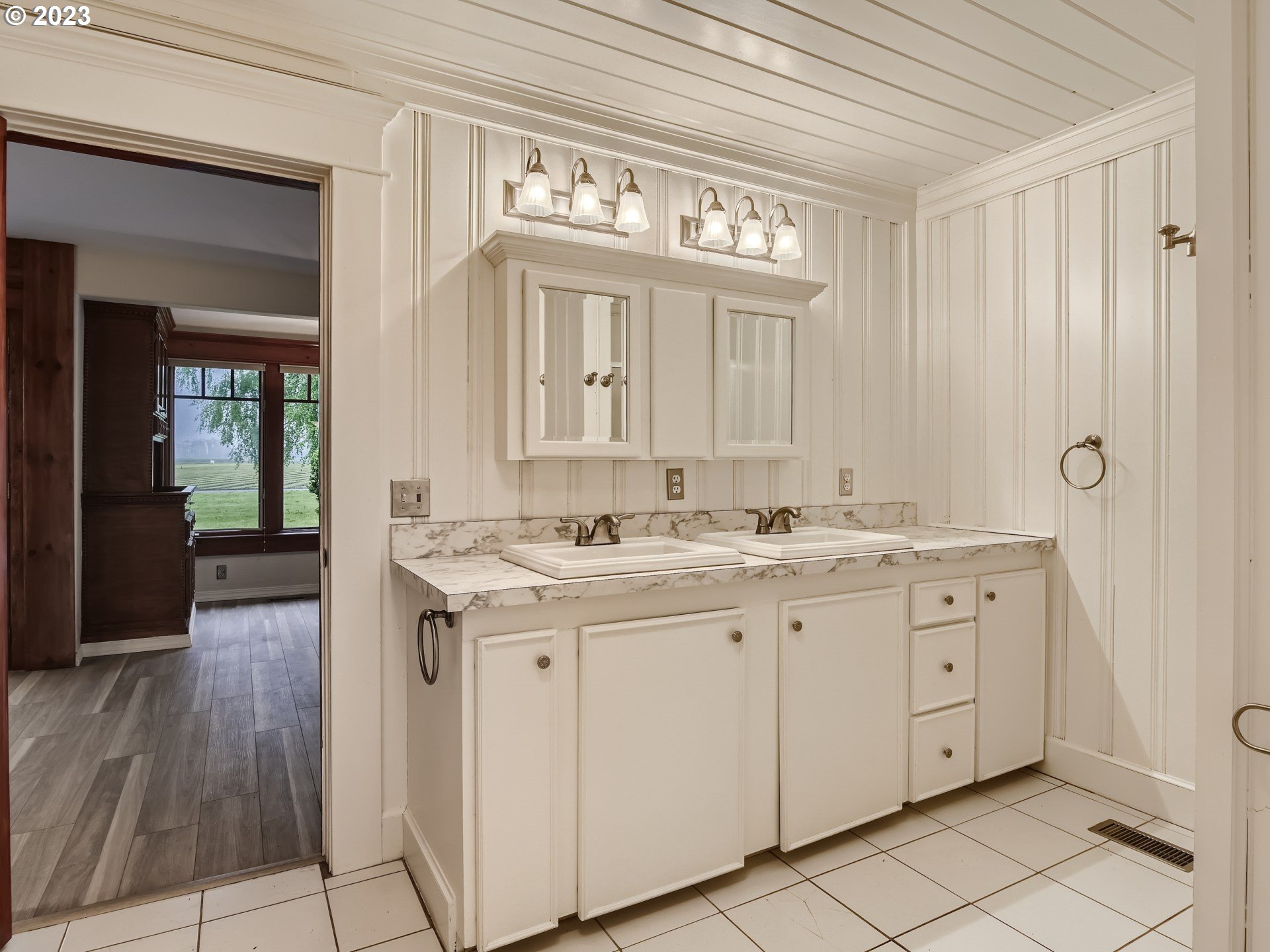 32062 South Barlow Road Canby, OR 97013 - Photo 17 of 33 a spacious bathroom with a granite countertop sink a mirror and a