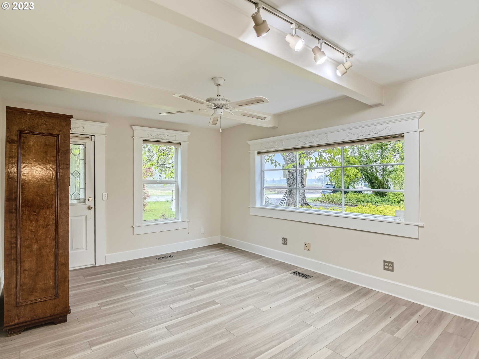 32062 South Barlow Road Canby, OR 97013 - Photo 18 of 33 a view of an empty room with wooden floor and a window