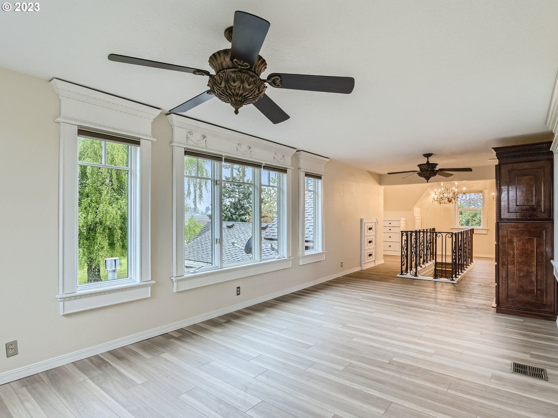 32062 South Barlow Road Canby, OR 97013 - Photo 22 of 33 a view of an empty room with a window and wooden floor