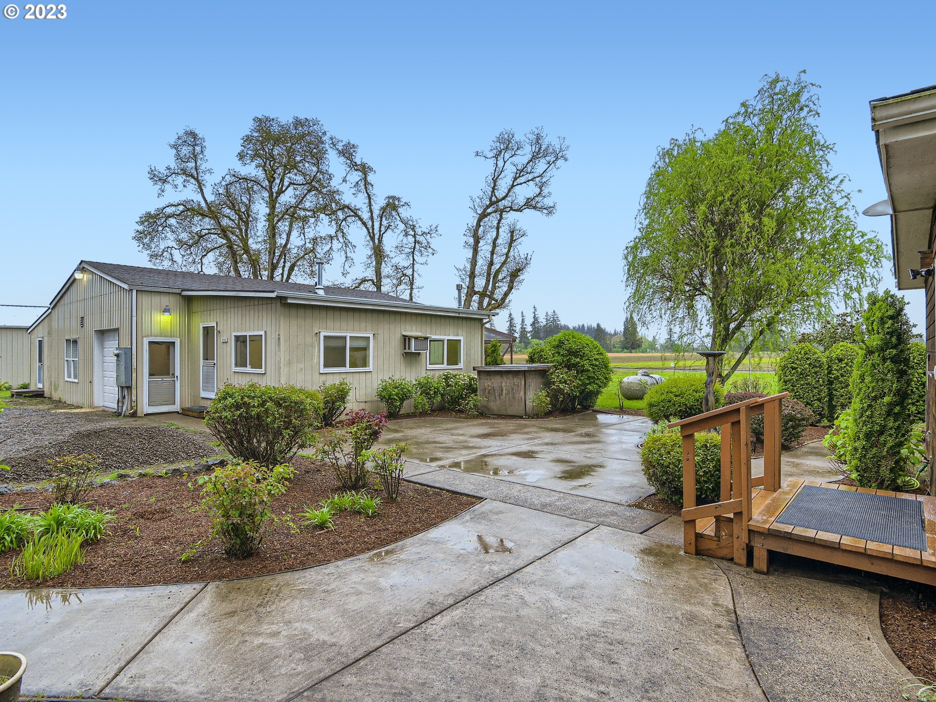32062 South Barlow Road Canby, OR 97013 - Photo 27 of 33 a view of a house with a patio