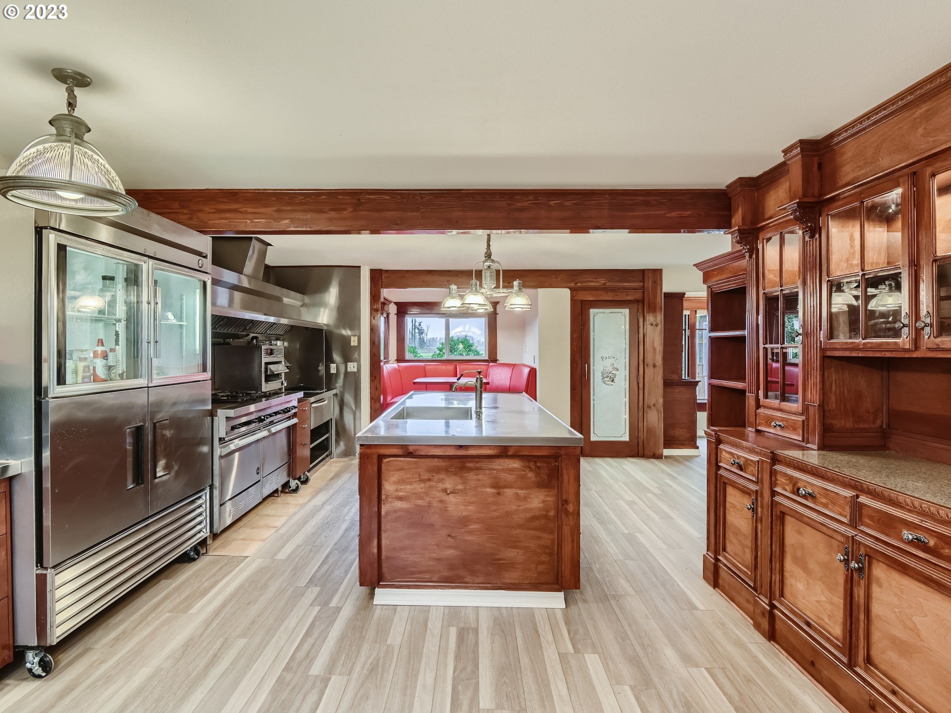 32062 South Barlow Road Canby, OR 97013 - Photo 7 of 33 a dining hall with stainless steel appliances granite countertop a stove and a wooden floors