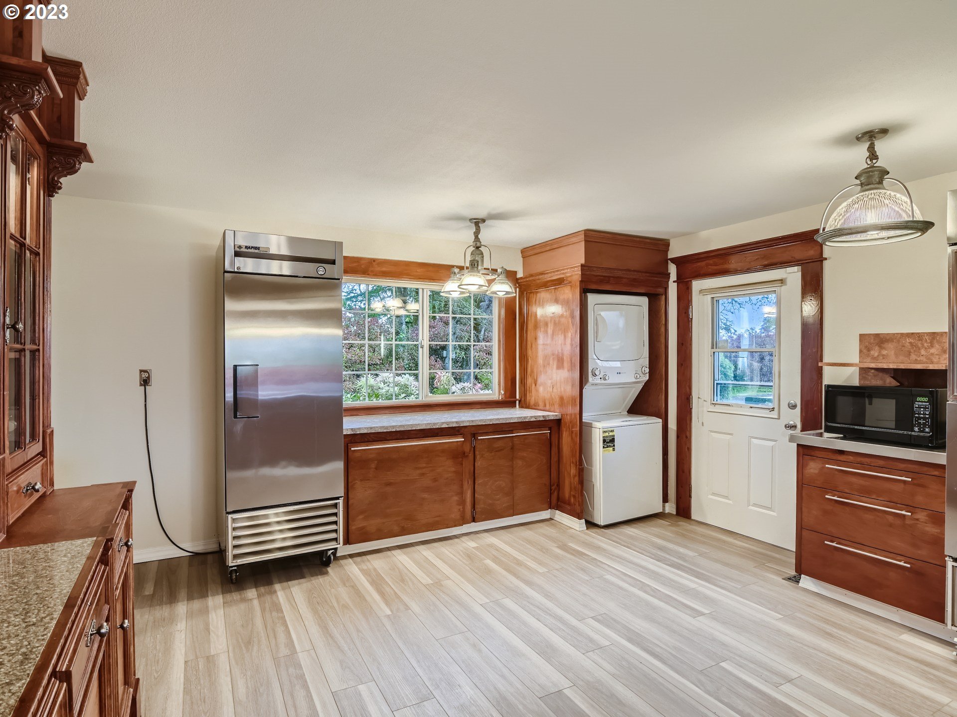 32062 South Barlow Road Canby, OR 97013 - Photo 9 of 33 a kitchen with stainless steel appliances a refrigerator and a stove top oven