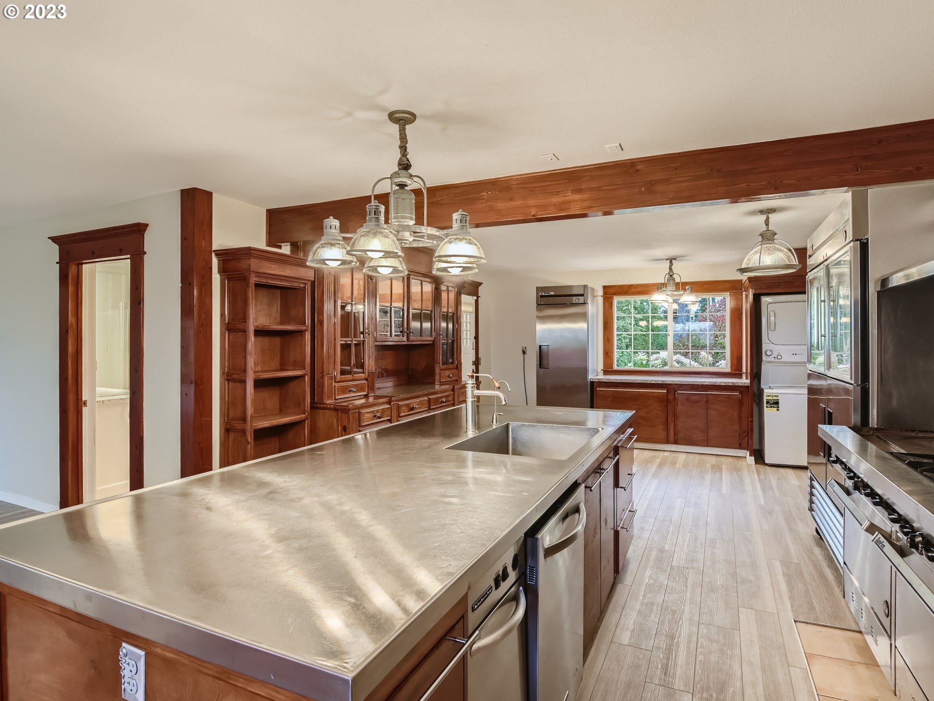 32062 South Barlow Road Canby, OR 97013 - Photo 10 of 33 a kitchen with stainless steel appliances granite countertop a sink refrigerator and microwave