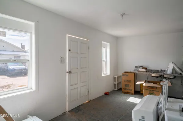 a room with furniture a window and a glass door