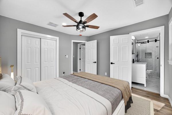 1864 Glen Echo Drive Decatur, GA 30032 - Photo 17 of 38 a bedroom with a large bed and a chandelier