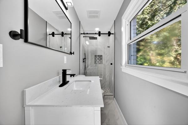 1864 Glen Echo Drive Decatur, GA 30032 - Photo 18 of 38 a bathroom with a sink and a mirror