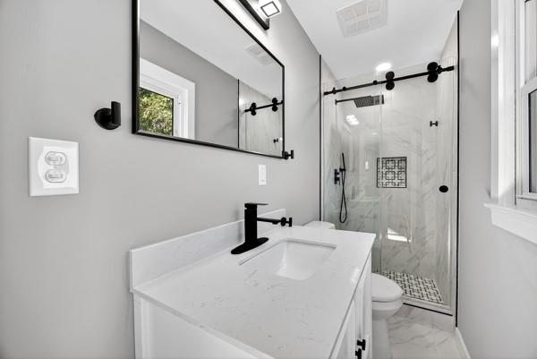 1864 Glen Echo Drive Decatur, GA 30032 - Photo 19 of 38 a bathroom with a sink a toilet and shower