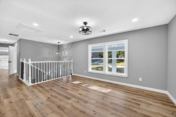 1864 Glen Echo Drive Decatur, GA 30032 - Photo 22 of 38 a view of an empty room with wooden floor and a window