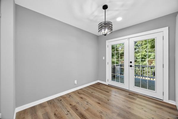 1864 Glen Echo Drive Decatur, GA 30032 - Photo 24 of 38 a view of an empty room with wooden floor and a window
