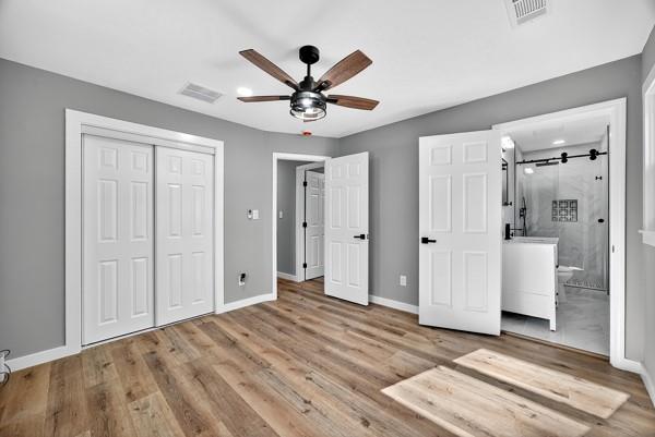 1864 Glen Echo Drive Decatur, GA 30032 - Photo 28 of 38 a view of a livingroom with a chandelier fan and wooden floor