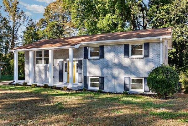 1864 Glen Echo Drive Decatur, GA 30032 - Photo 35 of 38 a view of a yard in front of a house with large windows