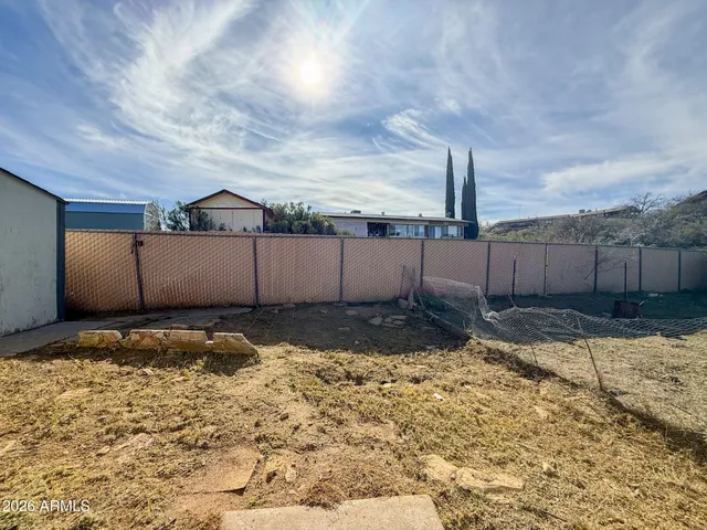 a house view with a backyard space