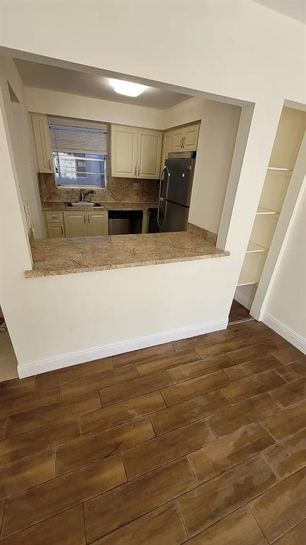 6505 Winfield Boulevard, Unit B6 Pompano Beach, FL 33063 - Photo 8 of 13 a view of kitchen and wooden floor