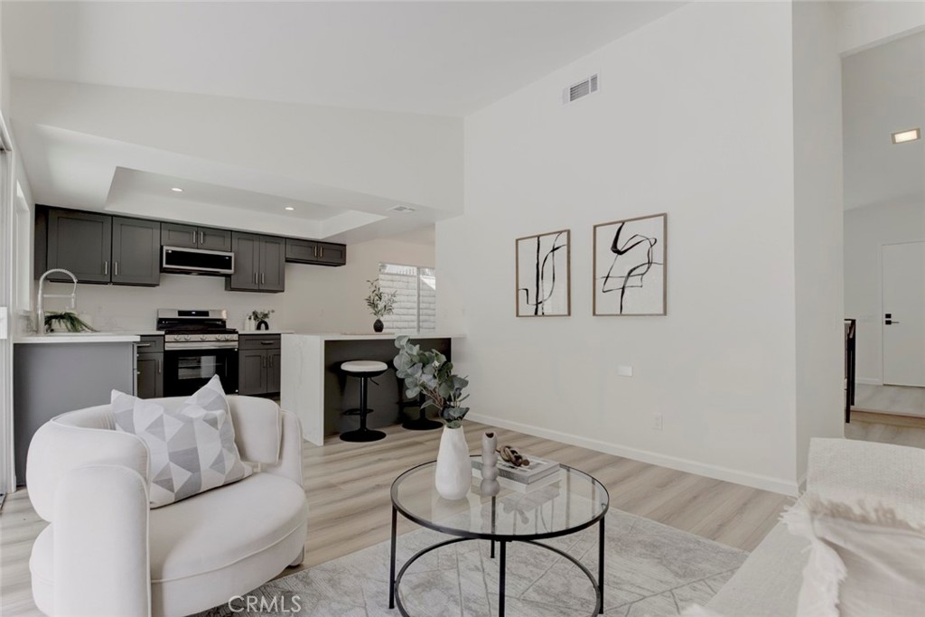 3256 North Frederic Street Burbank, CA 91504 - Photo 12 of 45 a living room with furniture kitchen view and a window