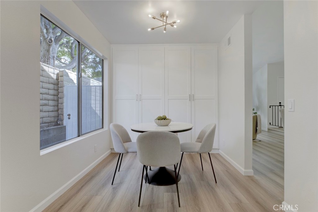 3256 North Frederic Street Burbank, CA 91504 - Photo 18 of 45 a view of a dining room with furniture and wooden floor