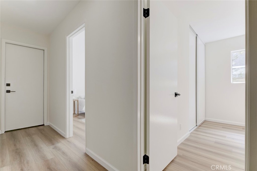 3256 North Frederic Street Burbank, CA 91504 - Photo 20 of 45 a view of a hallway with wooden floor