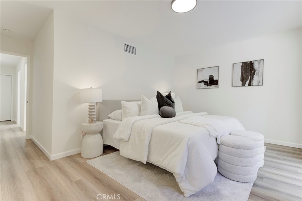3256 North Frederic Street Burbank, CA 91504 - Photo 23 of 45 a bedroom with a bed and a night stand