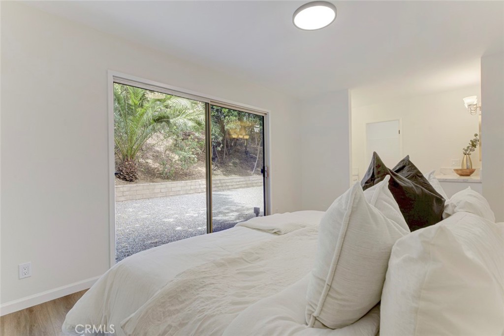 3256 North Frederic Street Burbank, CA 91504 - Photo 25 of 45 a bedroom with a large bed and a large window