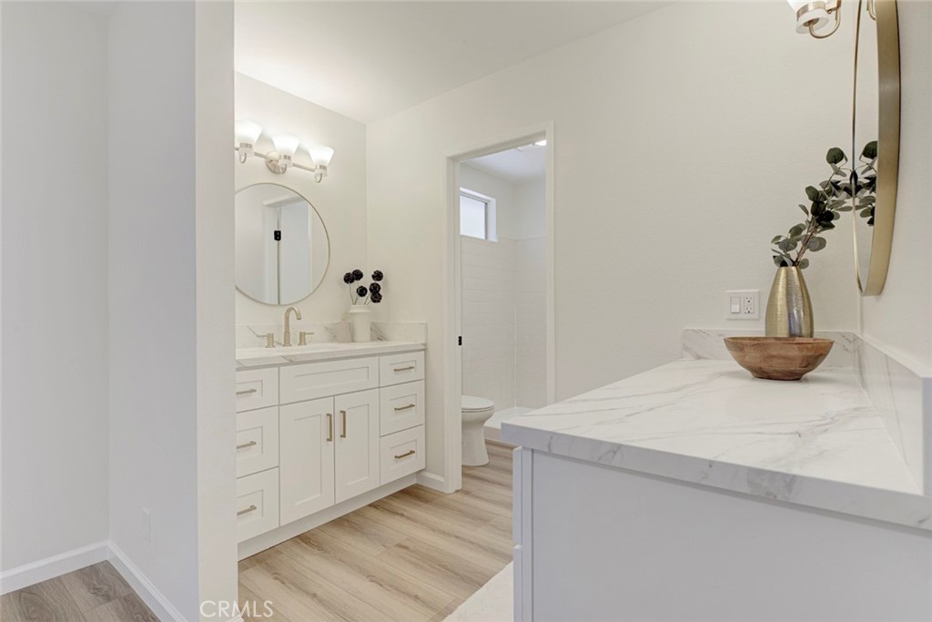 3256 North Frederic Street Burbank, CA 91504 - Photo 26 of 45 a bathroom with a sink and a mirror