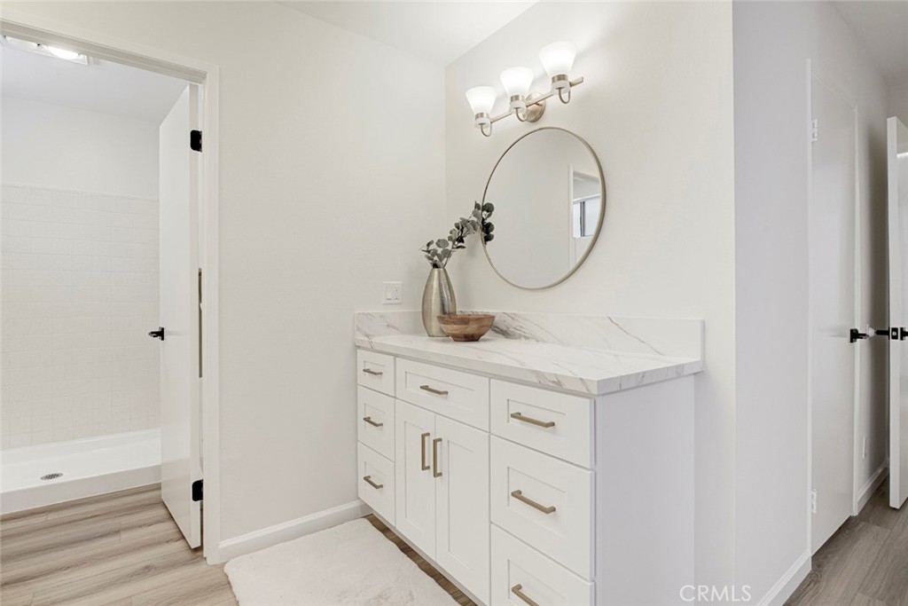 3256 North Frederic Street Burbank, CA 91504 - Photo 27 of 45 a bathroom with a sink a vanity and a mirror