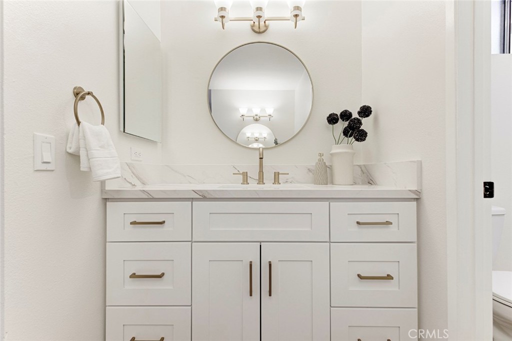 3256 North Frederic Street Burbank, CA 91504 - Photo 28 of 45 a bathroom with a sink and a mirror