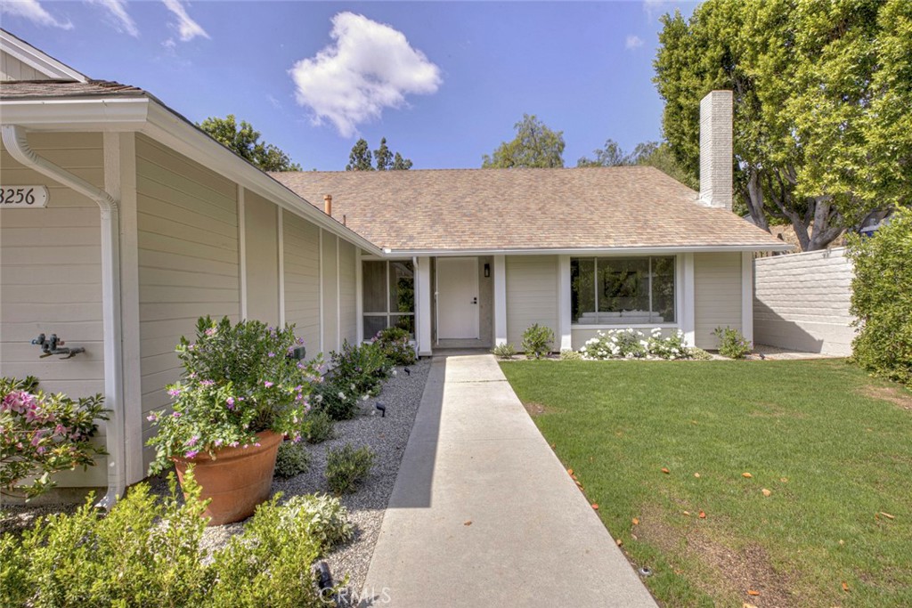 3256 North Frederic Street Burbank, CA 91504 - Photo 3 of 45 a front view of a house with a garden