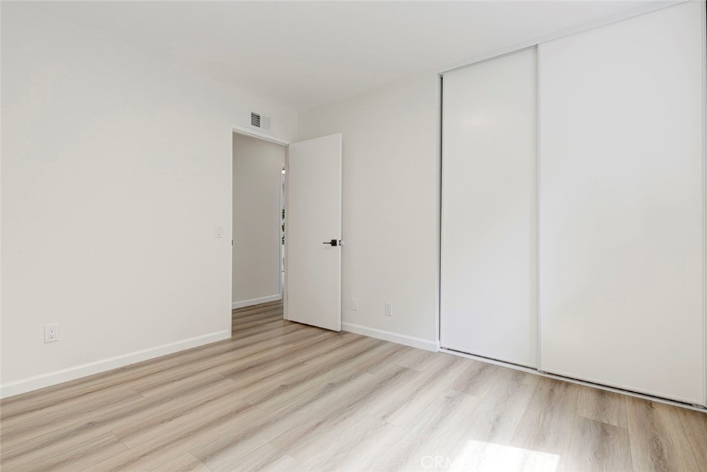 3256 North Frederic Street Burbank, CA 91504 - Photo 31 of 45 a view of an empty room with wooden floor