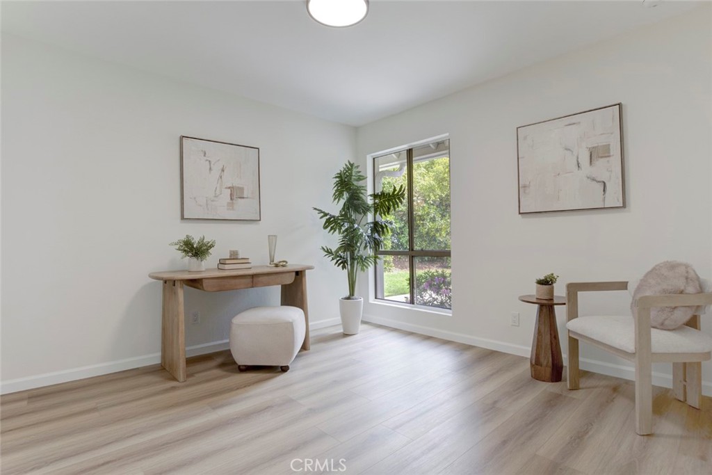 3256 North Frederic Street Burbank, CA 91504 - Photo 32 of 45 a living room with furniture and a wooden floor