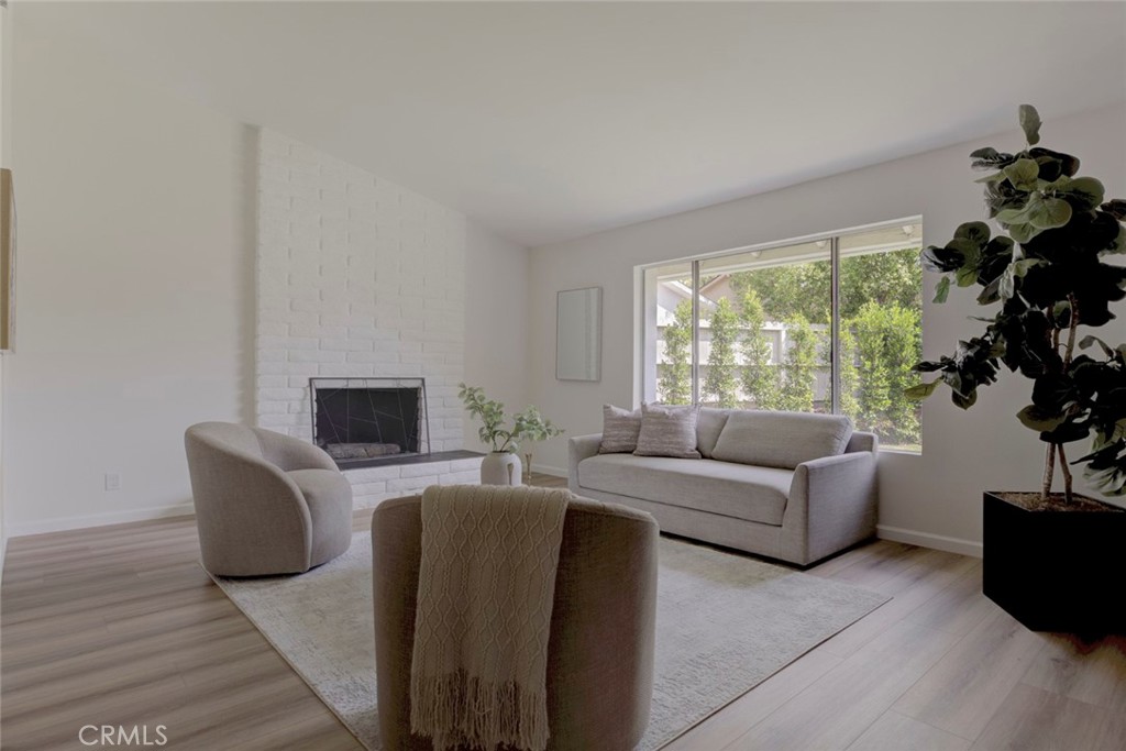 3256 North Frederic Street Burbank, CA 91504 - Photo 4 of 45 a living room with furniture a large window and a flat screen tv