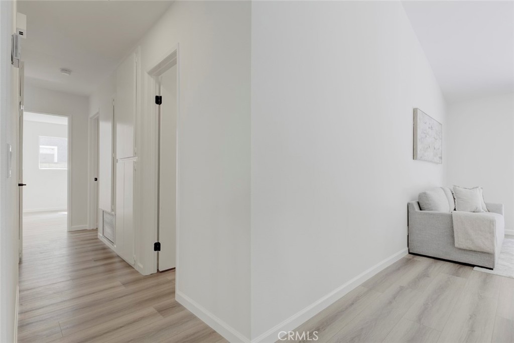 3256 North Frederic Street Burbank, CA 91504 - Photo 9 of 45 a view of a room with wooden floor and white walls