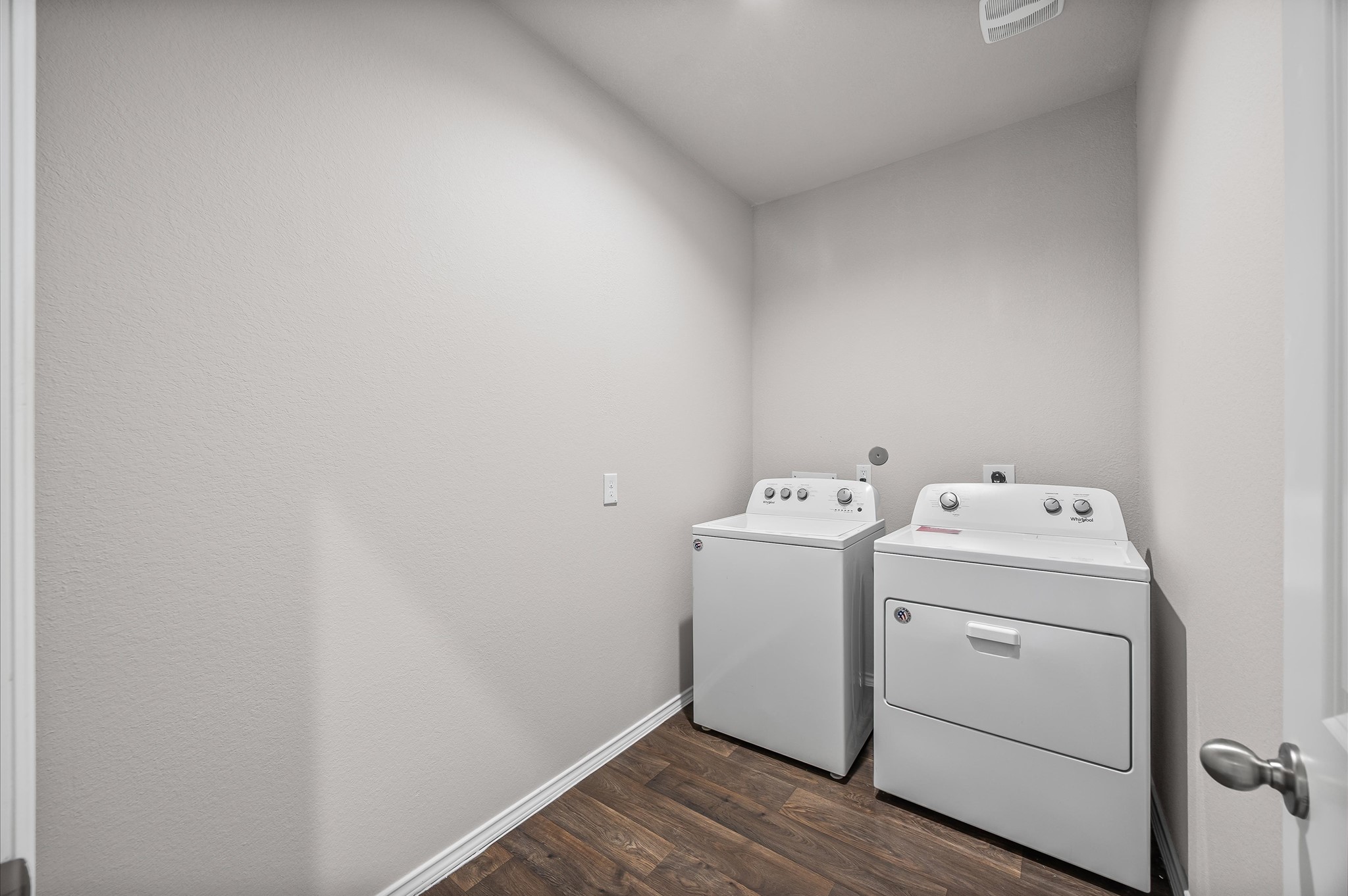 23522 Wedgewood Cliff Way Spring, TX 77373 - Photo 21 of 30 This laundry room features plenty of space for a side by side washer and dryer set against a neutral wall, providing a clean and functional space for laundry tasks.