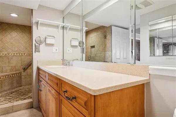 a bathroom with a sink a vanity and a mirror