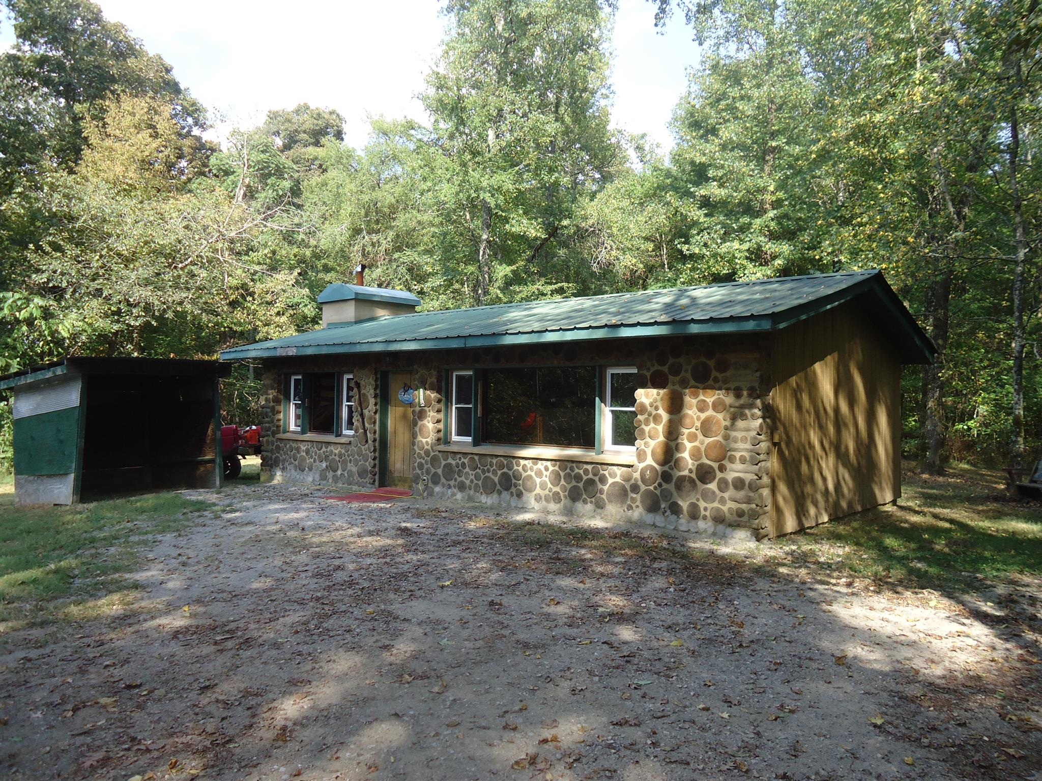 239 Loyd Road Pulaski, TN 38478 - Photo 1 of 19 a view of a house with a yard and sitting area