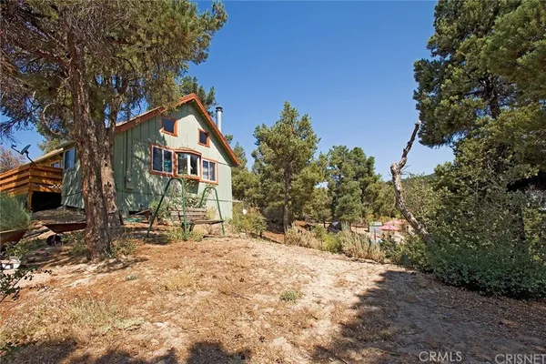 a view of a house with a snow in the yard