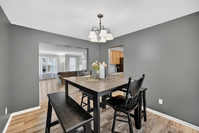 a view of a dining room with furniture and window