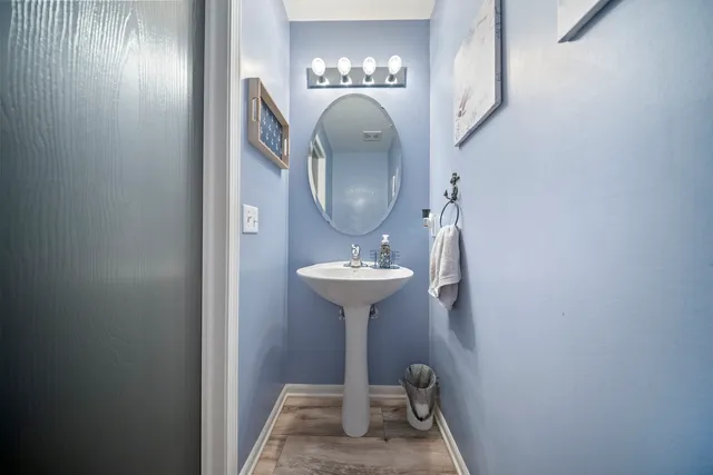 a bathroom with a sink and mirror