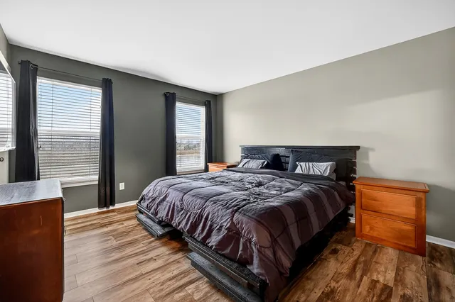 a bedroom with a bed and a dresser