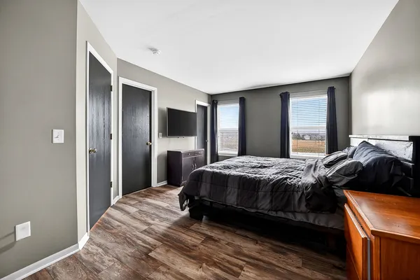 a bedroom with a bed and a dresser