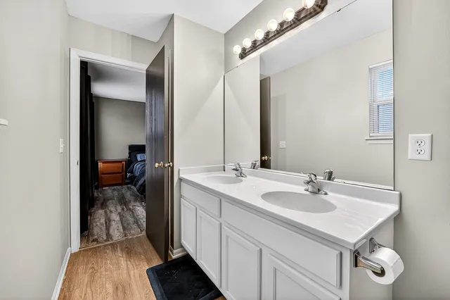 a bathroom with a sink and a mirror