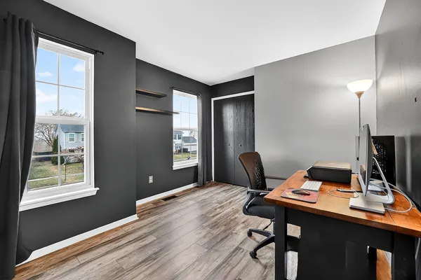 a workspace with furniture and window