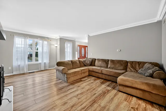 a living room with furniture and a table